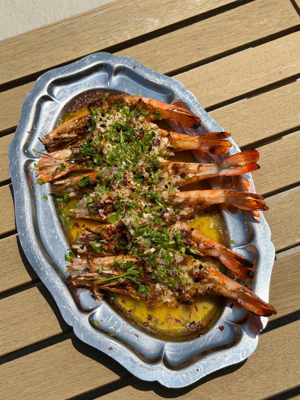 Grilled head-on prawns with garlic, herbs, and chili